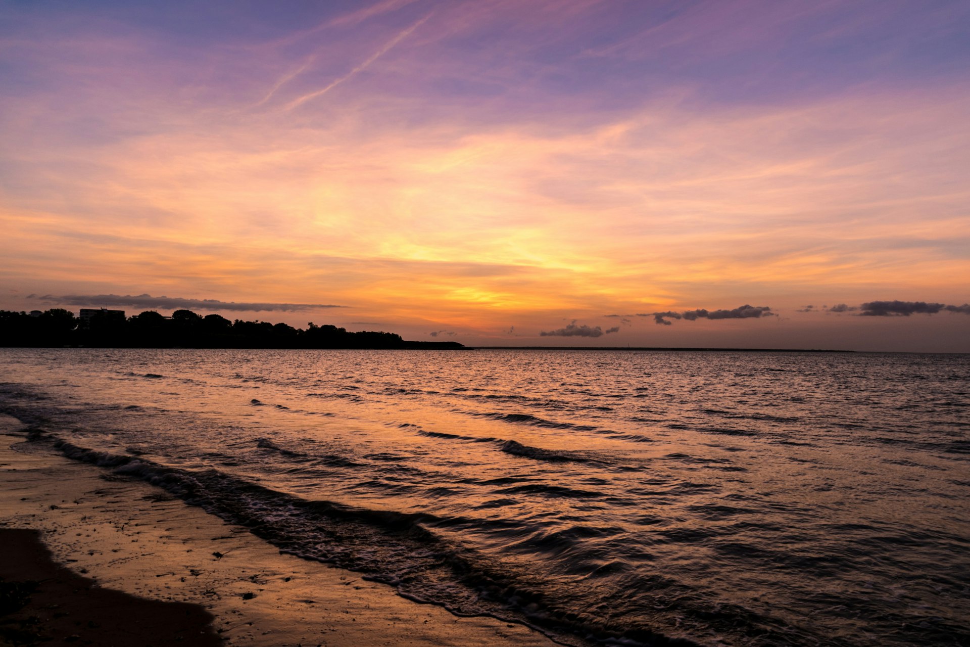 body of water during sunset